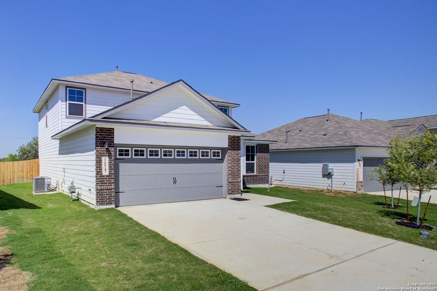 Front exterior of a new home in Hickory Ridge, San Antonio, TX, highlighting curb appeal (Image 41).