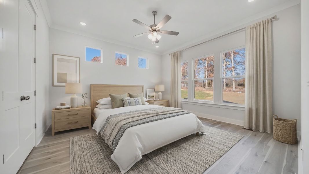 Virtually staged primary bedroom with large windows, ceiling fan, and bedroom furniture
