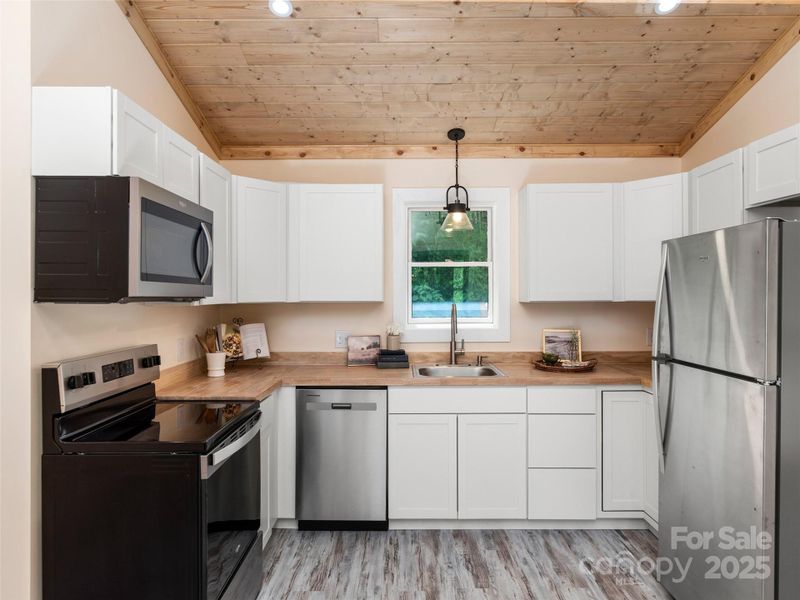 Furnished interior view inside a new home in , Waynesville (Image 9).