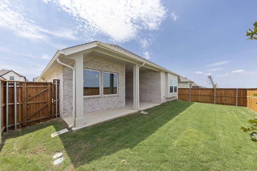 Exterior details and patio area of a home in Creekview Meadows, Pilot Point (Image 16).