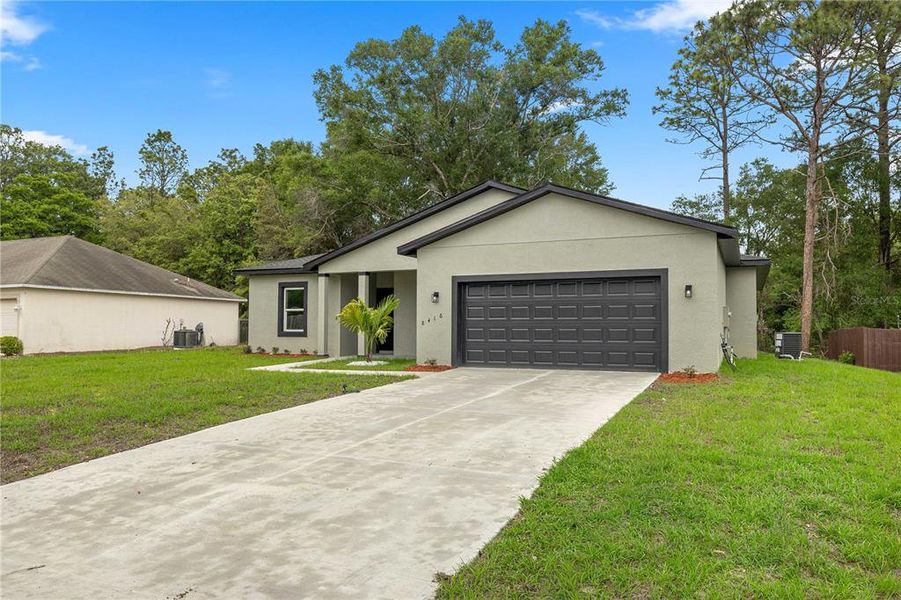 Front exterior of a new home in , Citrus Springs, FL, highlighting curb appeal (Image 16).