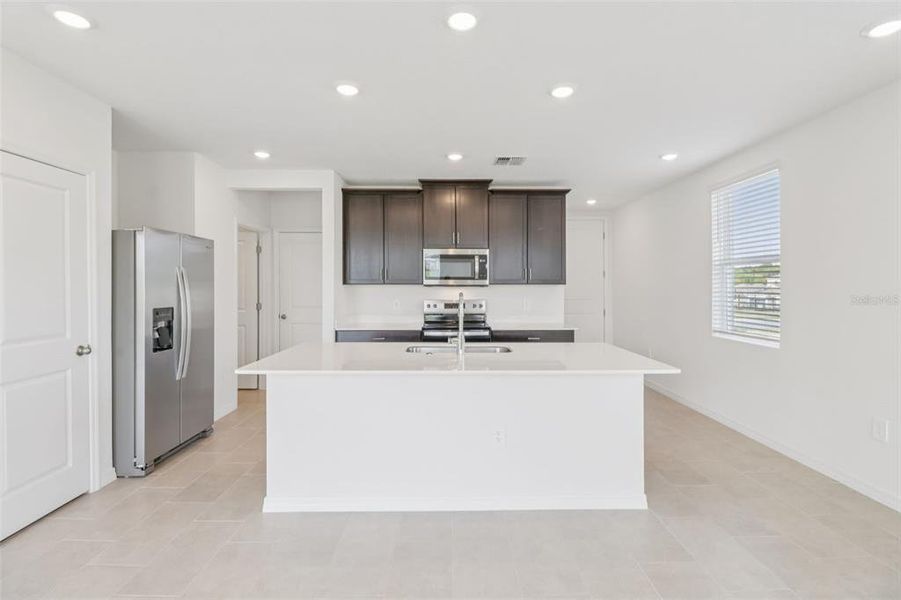 Furnished interior view inside a new home in The Reserve at Hammock Oaks Townes, Lady Lake (Image 7). Furnished interior view inside a new home in The Reserve at Hammock Oaks Townes, Lady Lake (Image 7).