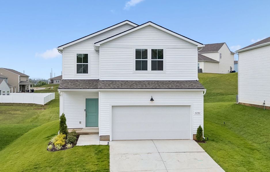 Front exterior of a new home in Highlands of Carter's Station, Columbia, TN, highlighting curb appeal (Image 2). Front exterior of a new home in Highlands of Carter's Station, Columbia, TN, highlighting curb appeal (Image 2).