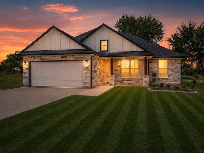 Front exterior of a new home in , Bowie, TX, highlighting curb appeal (Image 20).