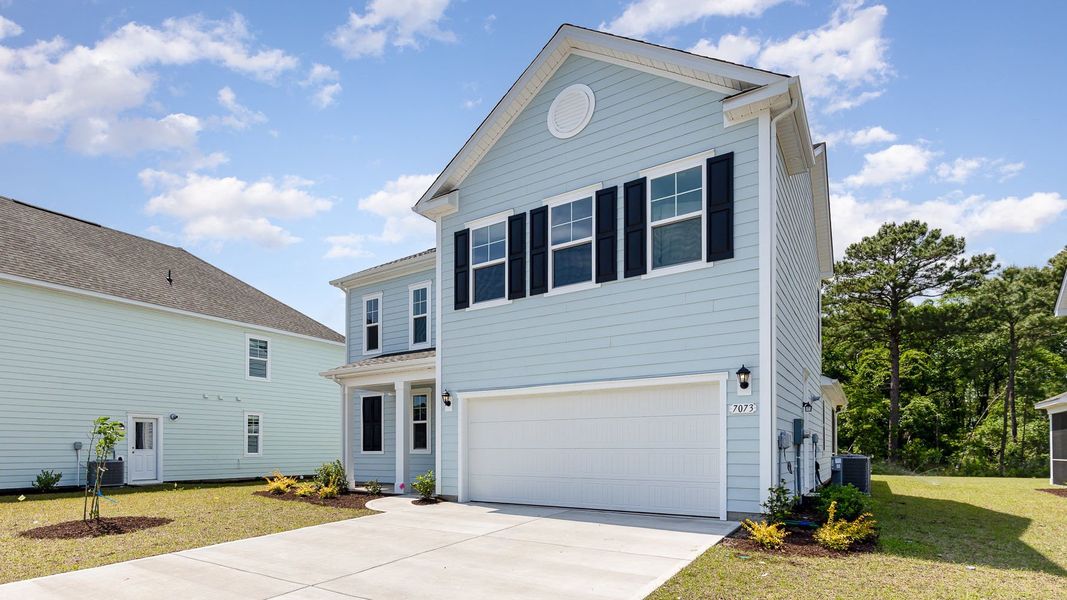 Front exterior of a new home in Waterbridge, Myrtle Beach, SC, highlighting curb appeal (Image 2).
