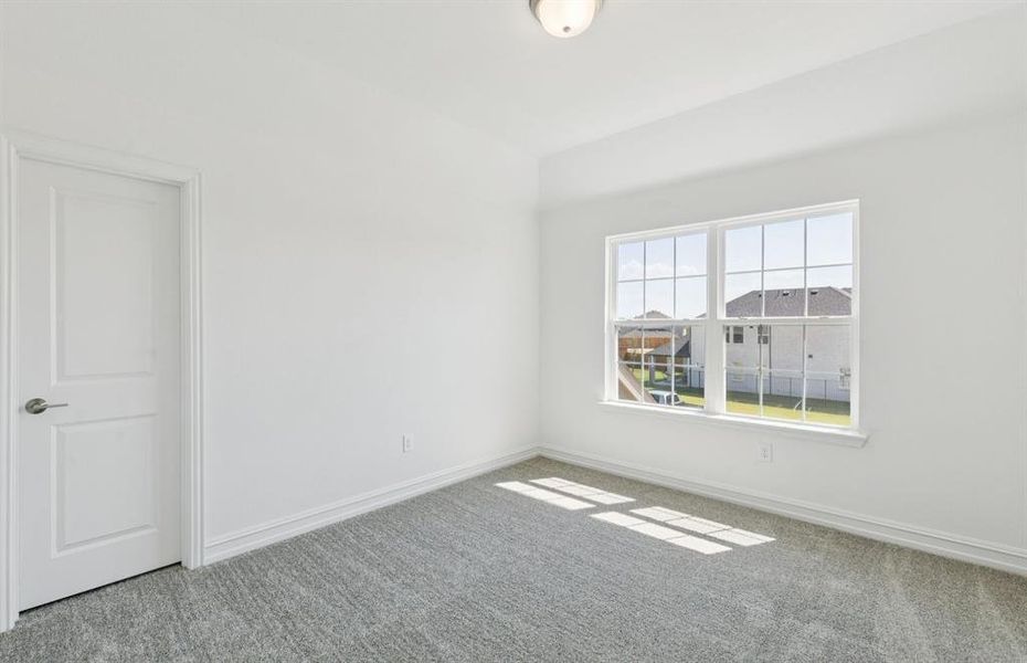 Spacious secondary bedroom with large windows Spacious secondary bedroom with large windows