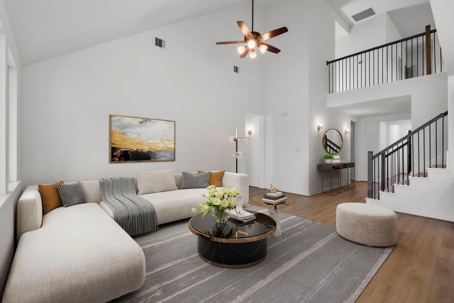 Open living room has high ceilings with views to upstairs.