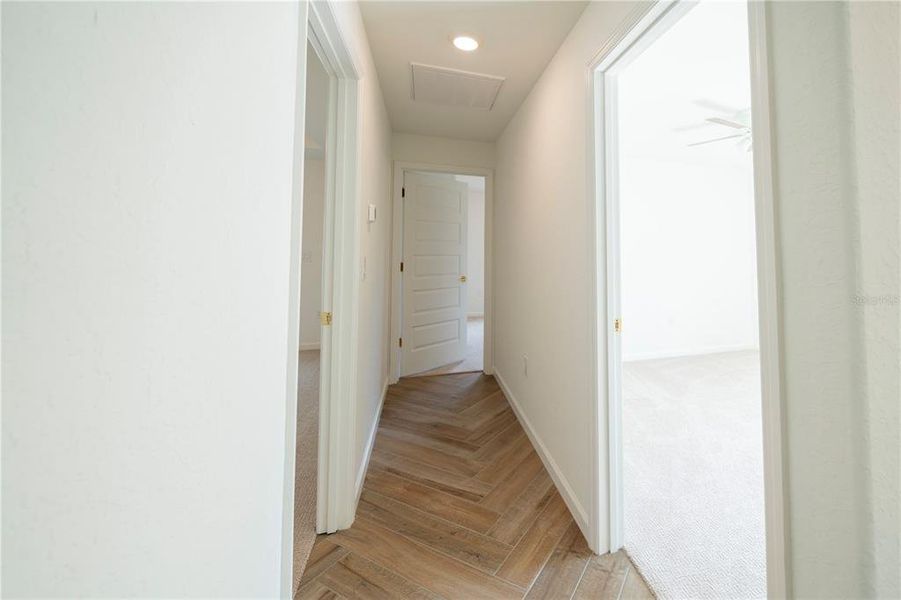 Hallway to bedrooms and bathrooms