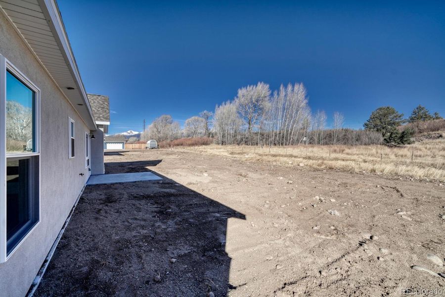 Back of home with patio area Back of home with patio area