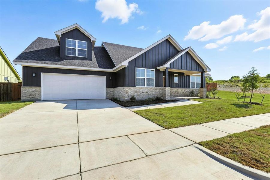 Front exterior of a new home in Stoneview, Glen Rose, TX, highlighting curb appeal (Image 21). Front exterior of a new home in Stoneview, Glen Rose, TX, highlighting curb appeal (Image 21).