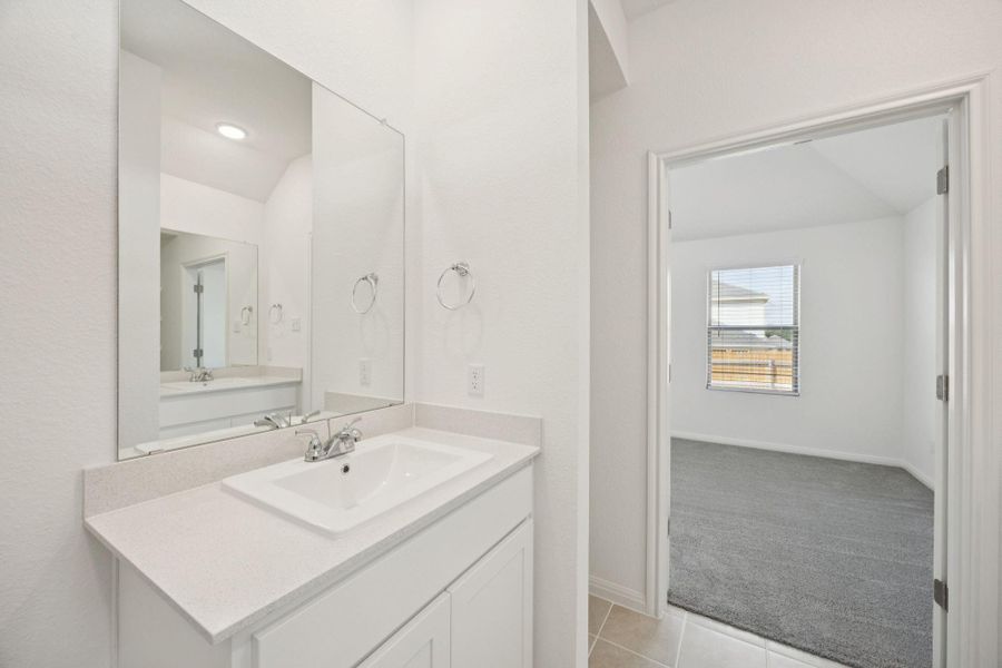 Bathroom with vanity and tile patterned flooring