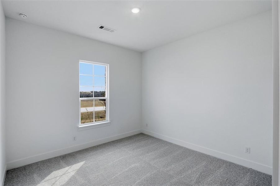 Unfurnished room featuring carpet floors and recessed lighting
