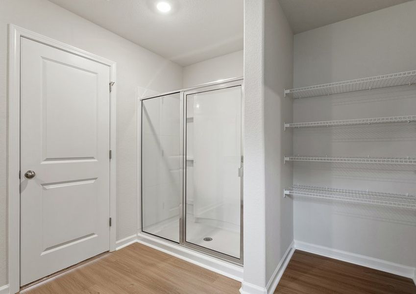 This bathroom has a glass-enclosed shower