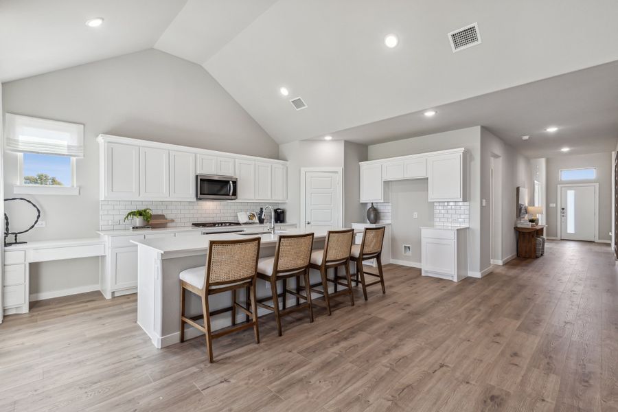 Kitchen in the Wimbledon home plan by Trophy Signature Homes – REPRESENTATIVE PHOTO