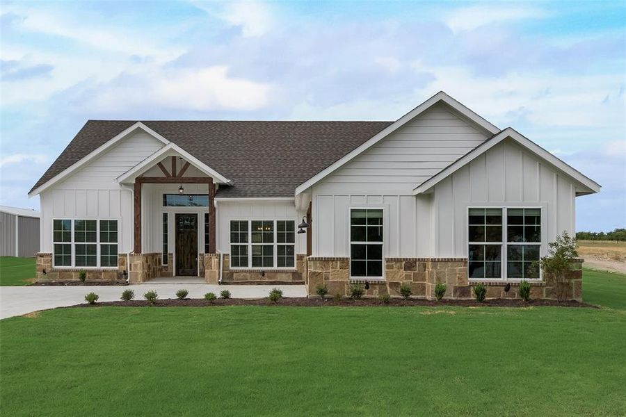 View of front of property with a front lawn