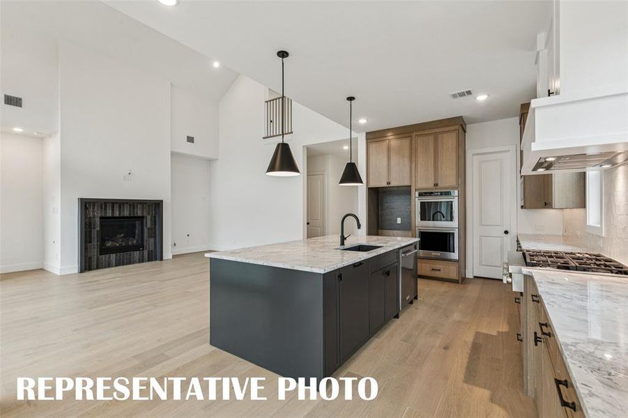 With the perfect open concept design, the chef in the family will never be left out of the party in our Addison III floor plan.  REPRESENTATIVE PHOTO.