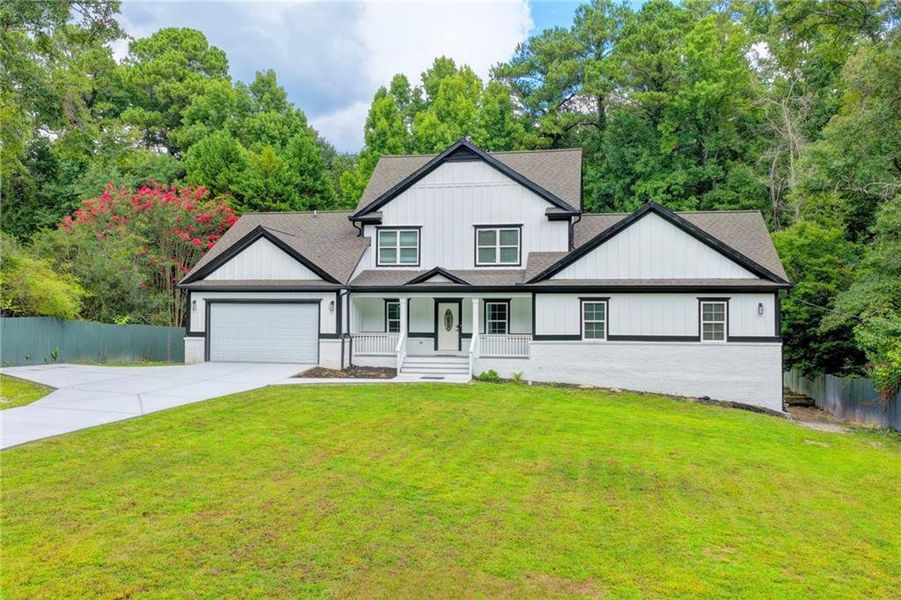 Front exterior of a new home in , Snellville, GA, highlighting curb appeal (Image 31). Front exterior of a new home in , Snellville, GA, highlighting curb appeal (Image 31).