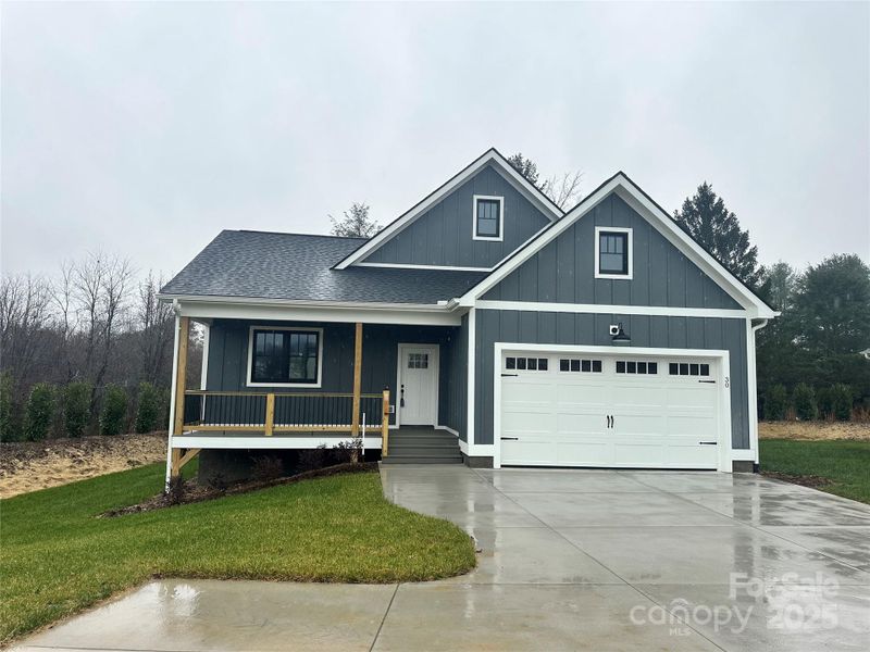 Front exterior of a new home in , Hendersonville, NC, highlighting curb appeal (Image 19).