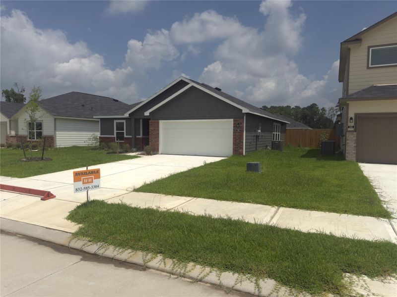 Front exterior of a new home in , Dayton, TX, highlighting curb appeal (Image 9).