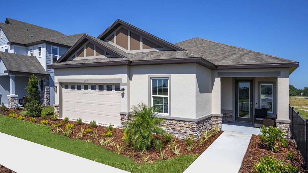 Front exterior of a new home in Coastal Communities, Edgewater, FL, highlighting curb appeal (Image 25).