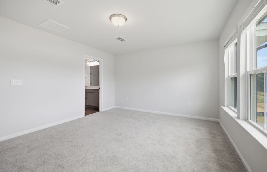 Spacious, unfurnished interior of a new home in Saunders Farm, Willow Spring (Image 14).