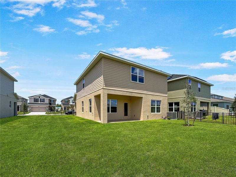 Front exterior of a new home in Harmony Central, Harmony, FL, highlighting curb appeal (Image 1).