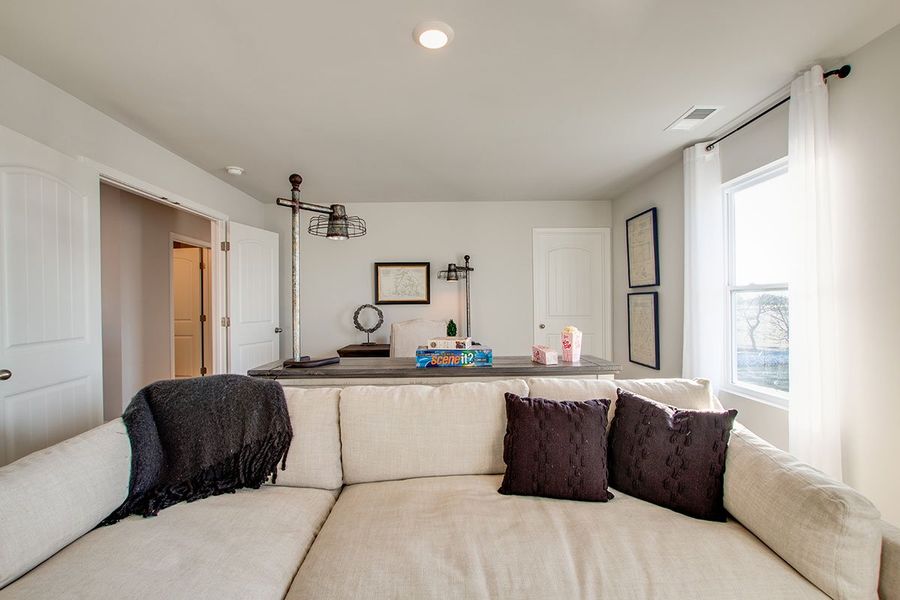 Representative furnished interior of a home built from the SALEM by D.R. Horton in The Parks, White House (Image 27).