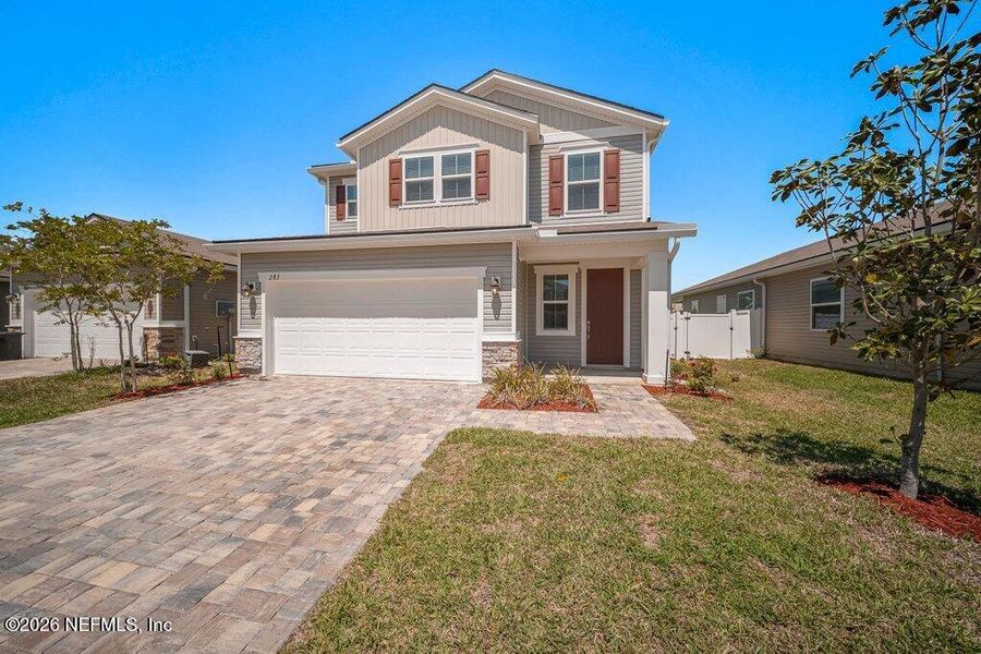 Front exterior of a new home in Verano Creek, St. Augustine, FL, highlighting curb appeal (Image 20).