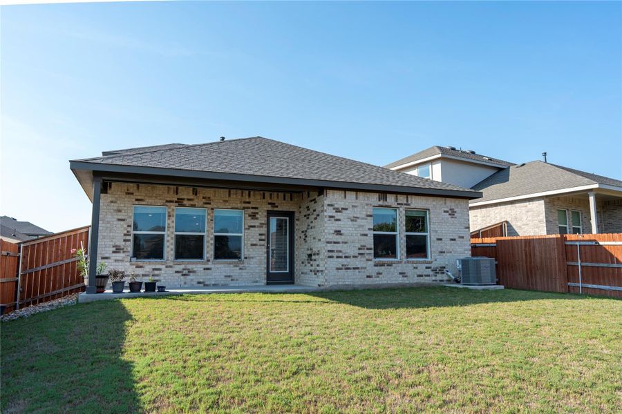 Front exterior of a new home in Bar W Ranch, Leander, TX, highlighting curb appeal (Image 22).