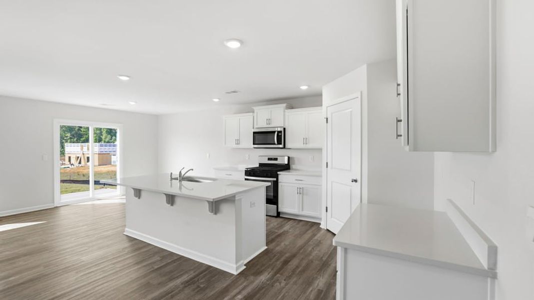 Furnished interior view inside a new home in Bentley Park, Greenwood (Image 6).