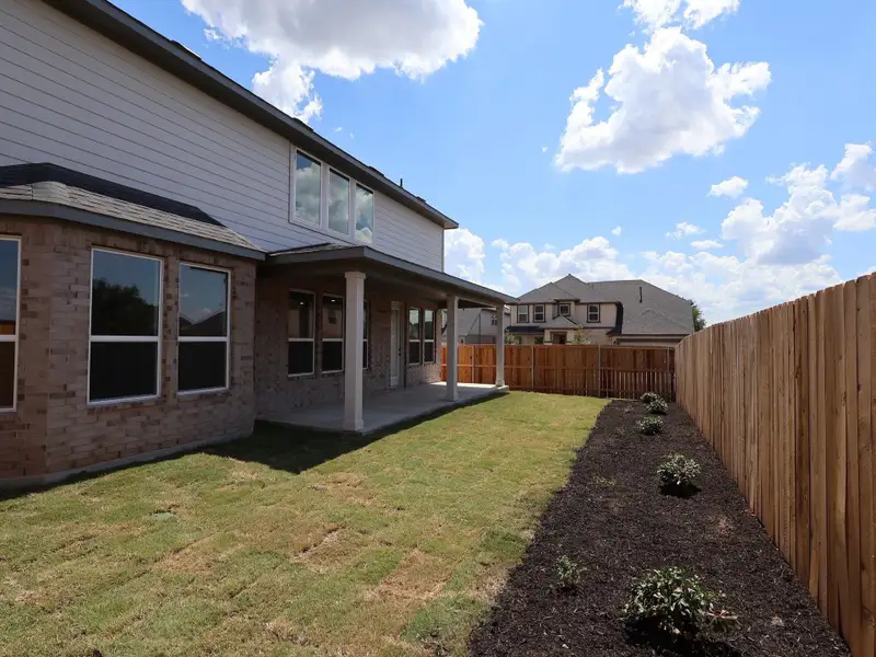Front exterior of a new home in Edgewood, Leander, TX, highlighting curb appeal (Image 2).