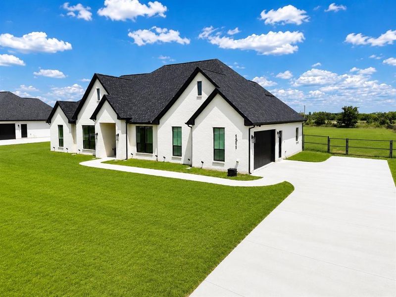 Front exterior of a new home in , Whitesboro, TX, highlighting curb appeal (Image 24).