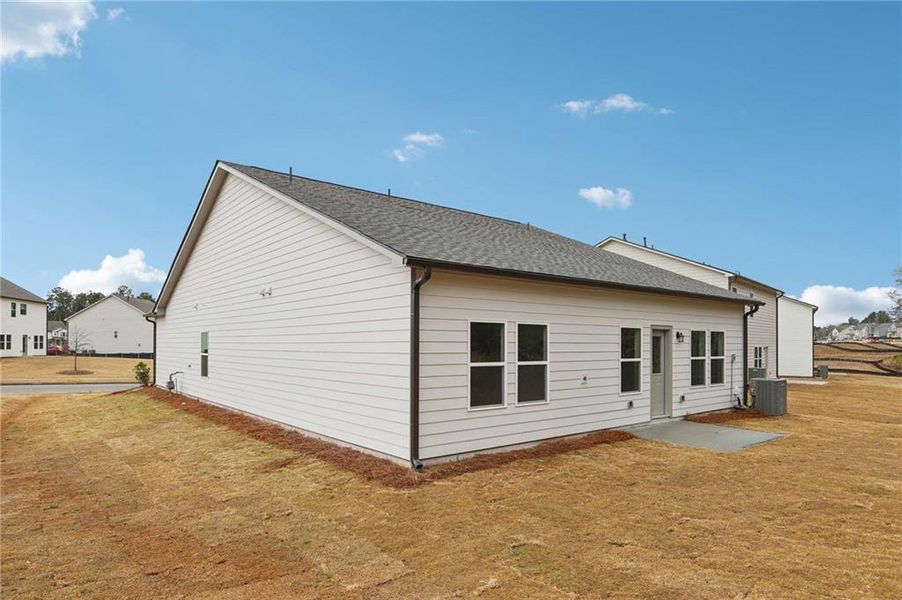 Exterior details and patio area of a home in The Pointe at Heron Bay, Locust Grove (Image 3).