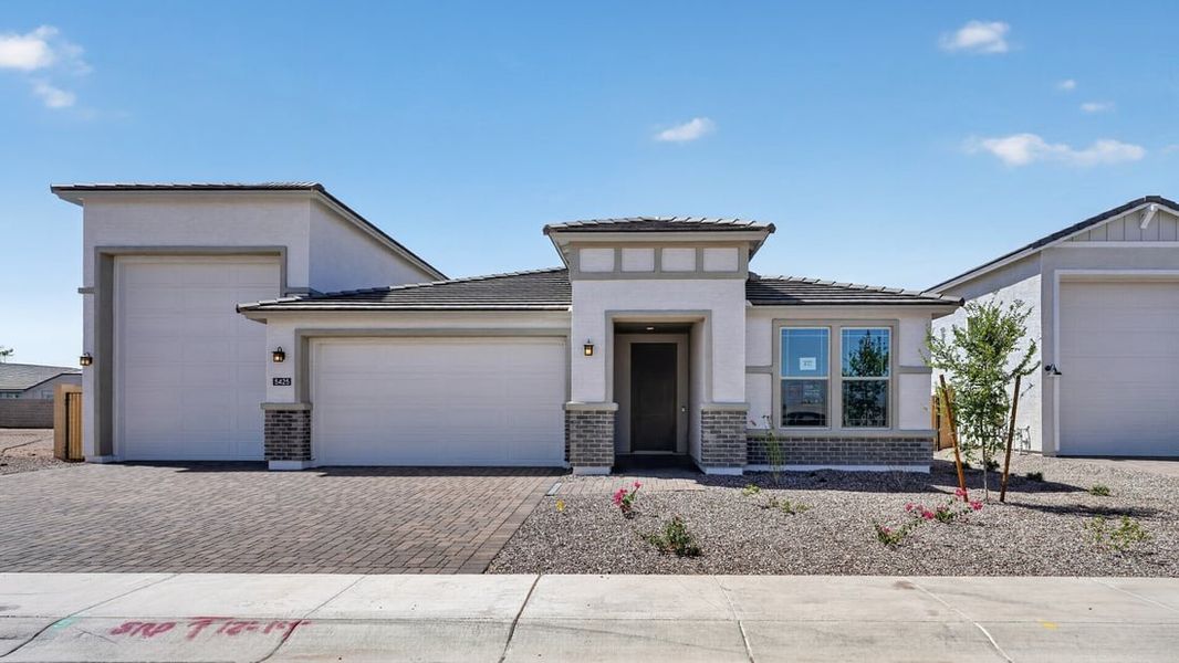 Front exterior of a new home in Salero Journey Collection, Phoenix, AZ, highlighting curb appeal (Image 1). Front exterior of a new home in Salero Journey Collection, Phoenix, AZ, highlighting curb appeal (Image 1).