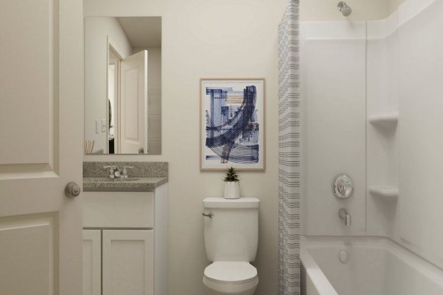 A bathroom with a toilet and a bathtub. A bathroom with a toilet and a bathtub.