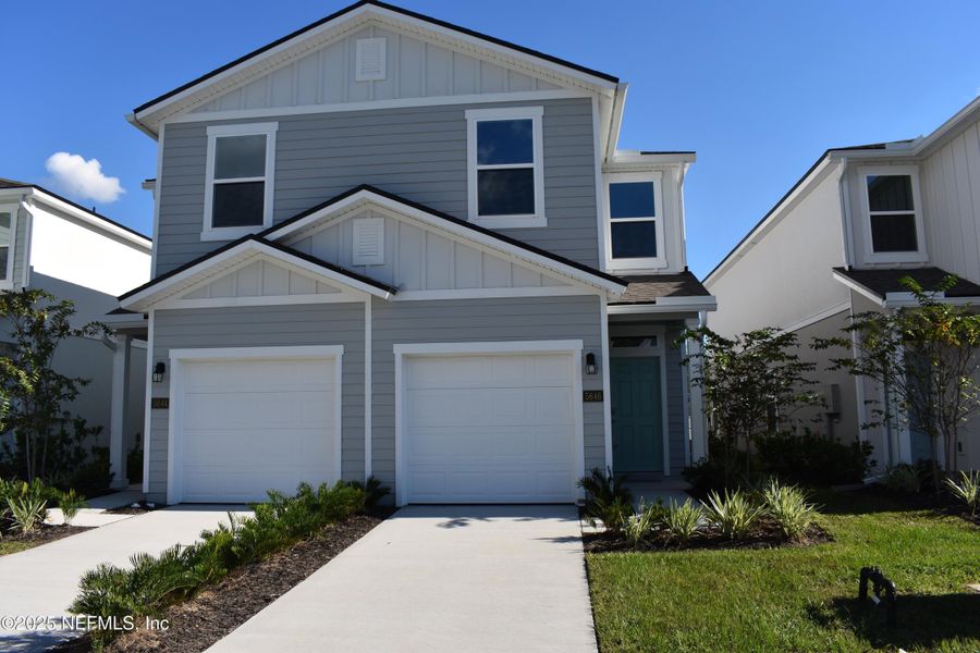 Front exterior of a new home in Irongate Villas, Jacksonville, FL, highlighting curb appeal (Image 28).