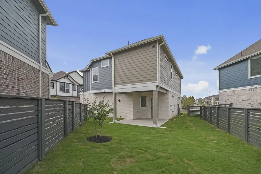 Exterior details and patio area of a home in Bridgeland Courtyard, Cypress (Image 3).