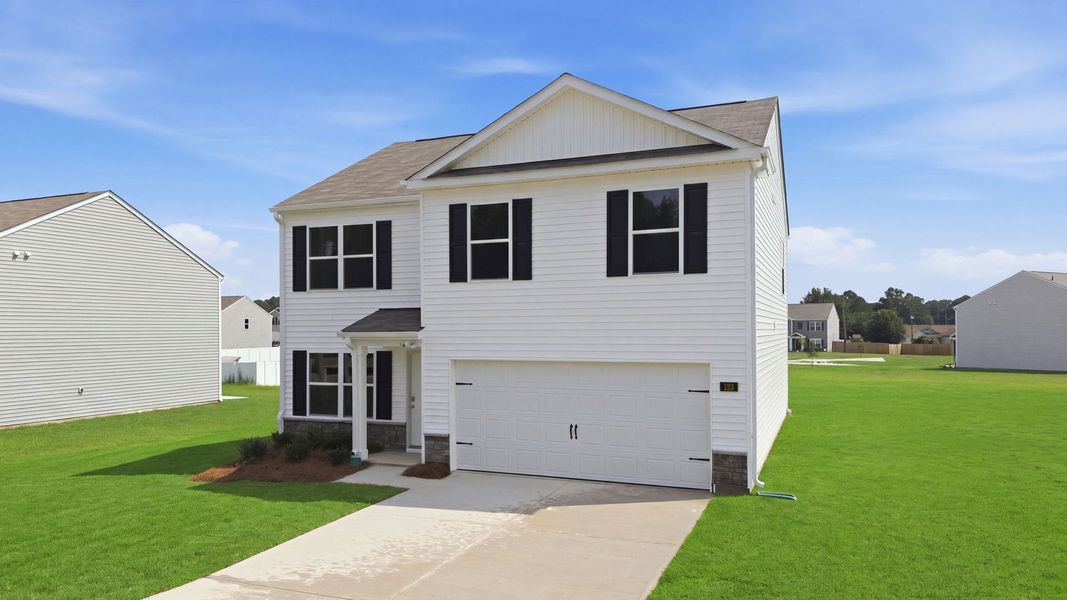 Front exterior of a new home in Blair Ridge, La Grange, NC, highlighting curb appeal (Image 15). Front exterior of a new home in Blair Ridge, La Grange, NC, highlighting curb appeal (Image 15).