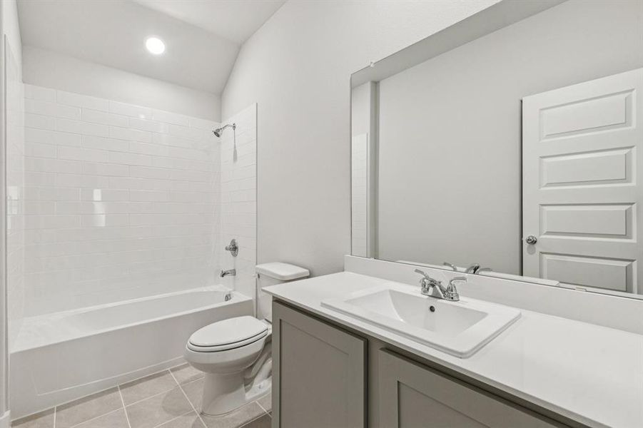 Bathroom in the Oscar home plan by Trophy Signature Homes – REPRESENTATIVE PHOTO