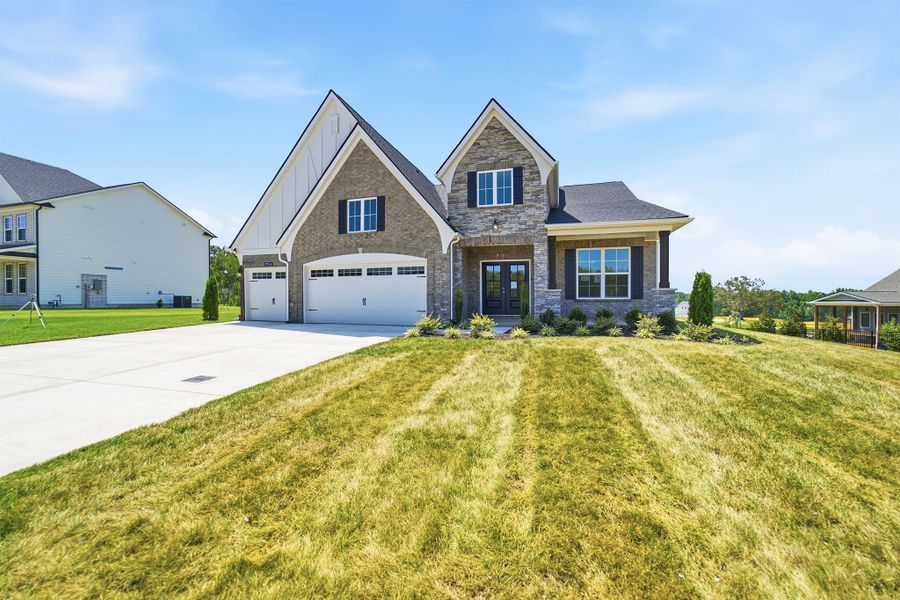 Front exterior of a new home in Aden Woods, Fairview, TN, highlighting curb appeal (Image 2).