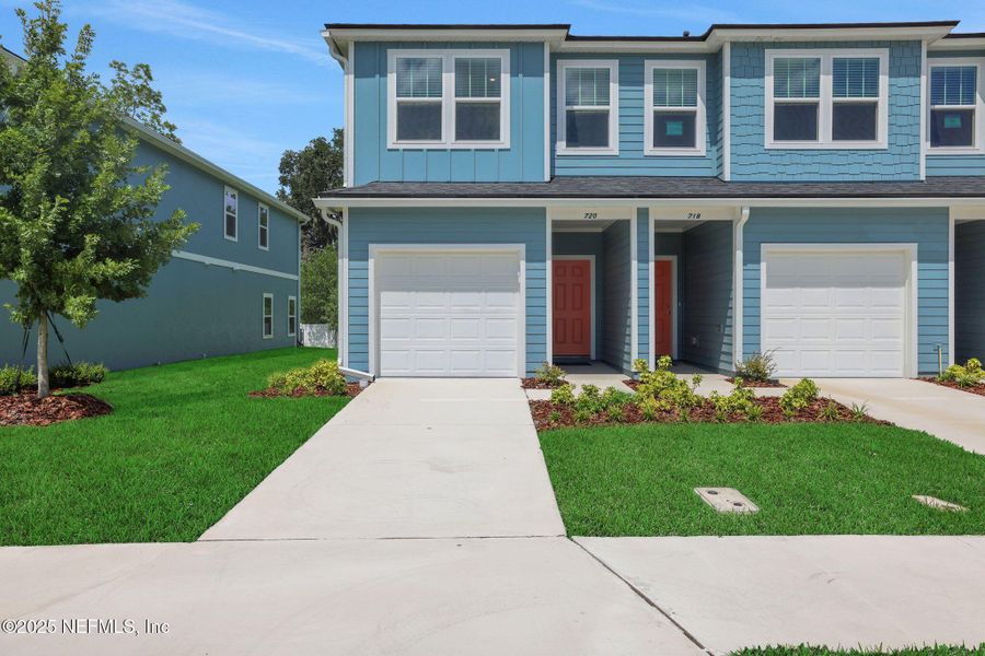 Front exterior of a new home in Kasen Oaks, Jacksonville, FL, highlighting curb appeal (Image 19).