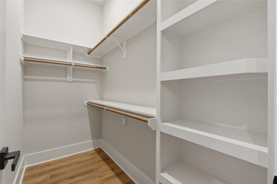Separate his and her closets offer the space and organization you’ve been looking for, complete with built-in shelving for effortless everyday living. Separate his and her closets offer the space and organization you’ve been looking for, complete with built-in shelving for effortless everyday living.