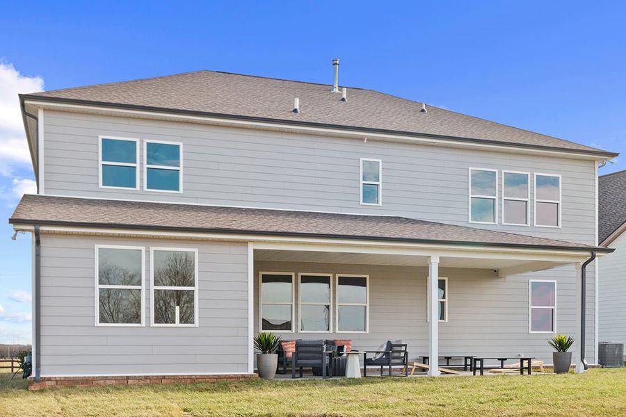 A house with a large front yard.