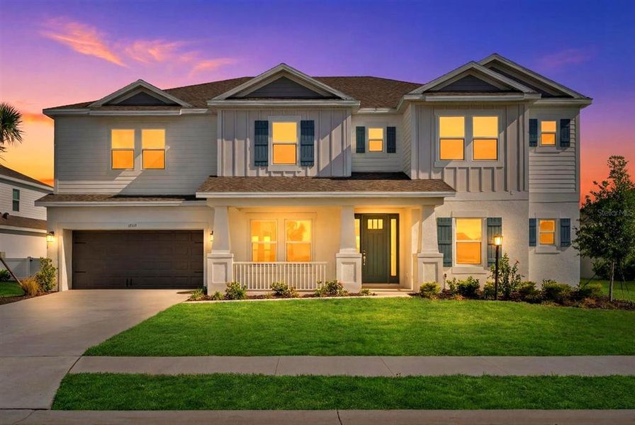 Front exterior of a new home in Park East at Azario, Bradenton, FL, highlighting curb appeal (Image 2). Front exterior of a new home in Park East at Azario, Bradenton, FL, highlighting curb appeal (Image 2).