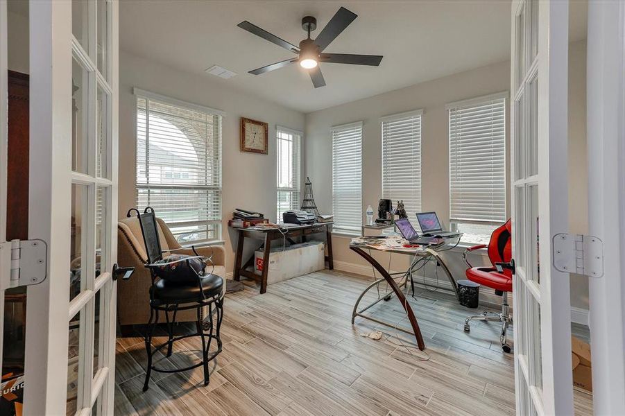 Spacious office with ceramic tiled flooring, ceiling fan and lots of natural light Spacious office with ceramic tiled flooring, ceiling fan and lots of natural light