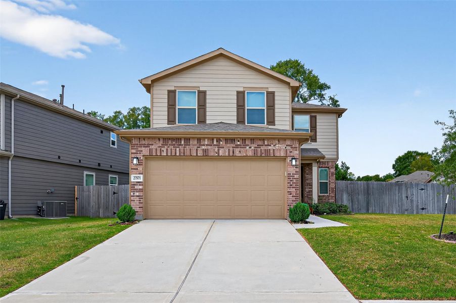 Front exterior of a new home in Creekside Court, Magnolia, TX, highlighting curb appeal (Image 1). Front exterior of a new home in Creekside Court, Magnolia, TX, highlighting curb appeal (Image 1).