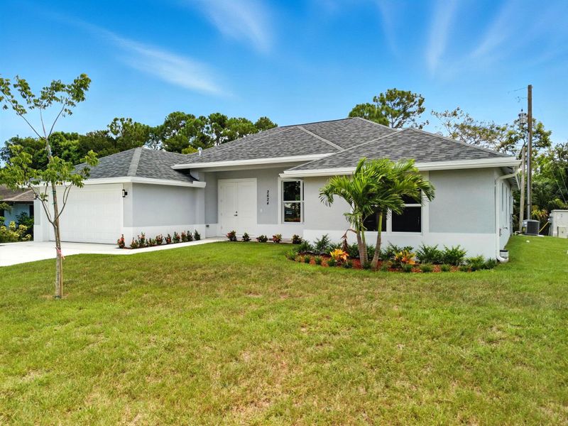 Front exterior of a new home in , Fort Pierce, FL, highlighting curb appeal (Image 19).