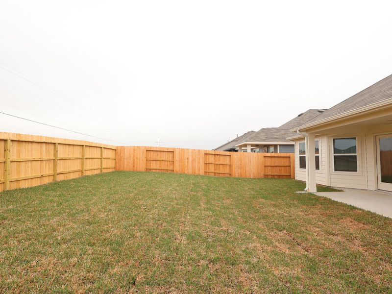 Exterior details and patio area of a home in Moran Ranch, Willis (Image 20).