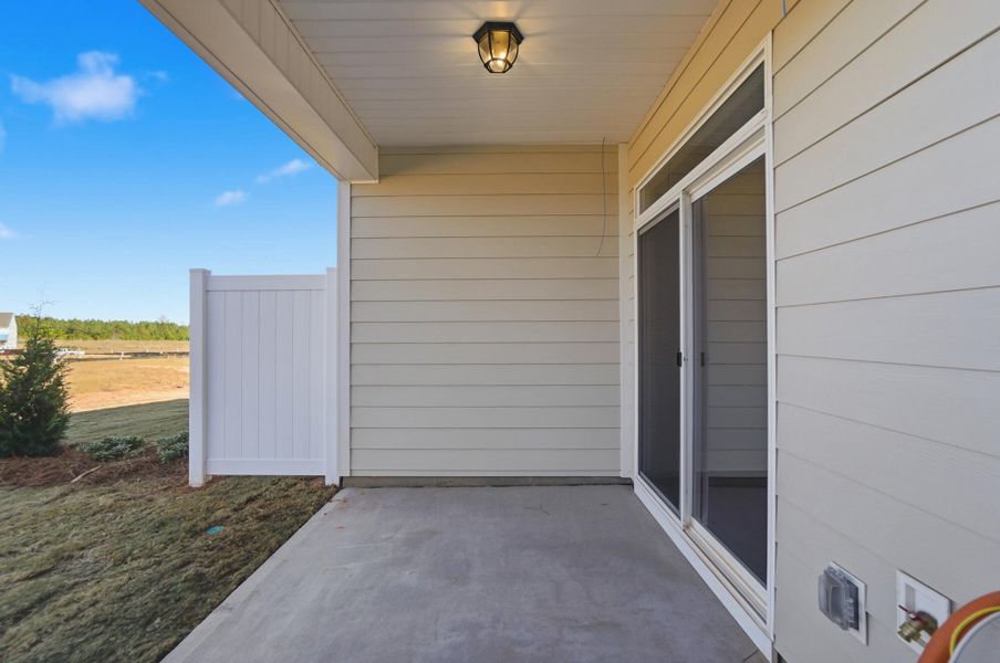Exterior details and patio area of a home in Blythe Mill Townhomes, Waxhaw (Image 31).