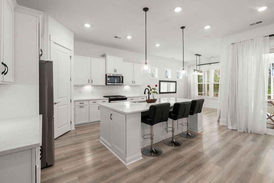 Furnished interior view inside a new home in Summerwind Crossing at Lakes of Cane Bay, Summerville (Image 14).